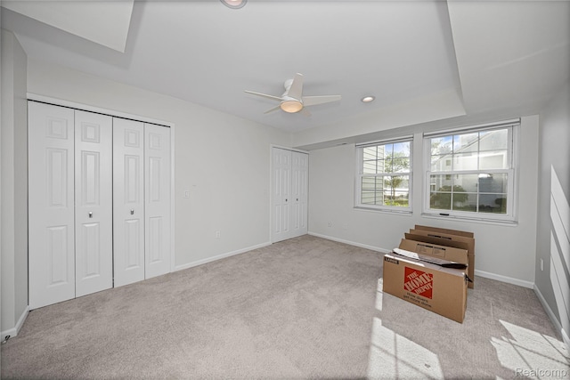 3565 Port Cove Dr Unit 68, Waterford, MI 48328 - unfurnished bedroom featuring multiple closets, carpet flooring, and ceiling fan