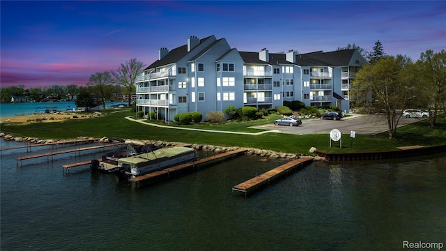3565 Port Cove Dr Unit 68, Waterford, MI 48328 - dock area with a water view and a yard