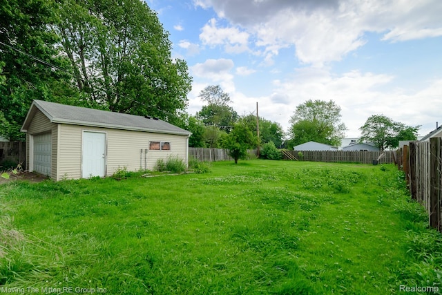11954 Timken Ave, Warren, MI 48089 - fenced backyard with an outbuilding and a garage