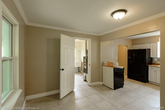 11954 Timken Ave, Warren, MI 48089 - kitchen with black refrigerator with ice dispenser, crown molding, white cabinets, light countertops, and light tile patterned flooring