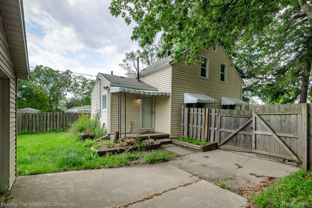 11954 Timken Ave, Warren, MI 48089 - back of house with a gate