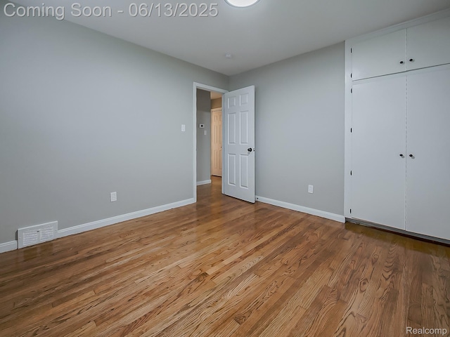 22854 Lingemann St, Saint Clair Shores, MI 48080 - unfurnished bedroom featuring wood finished floors and a closet