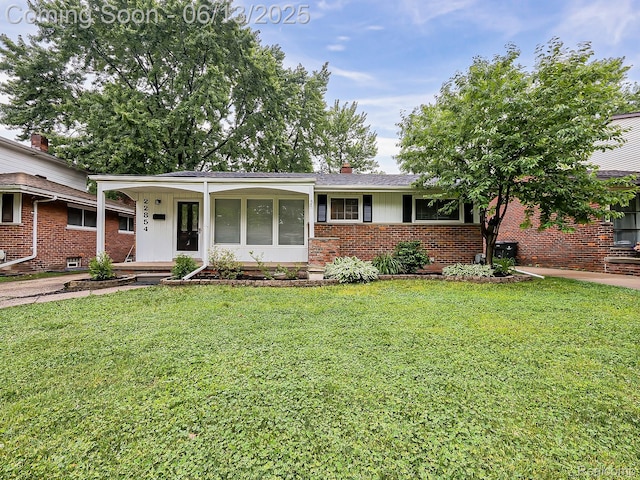 22854 Lingemann St, Saint Clair Shores, MI 48080 - view of front of house with a front yard and brick siding