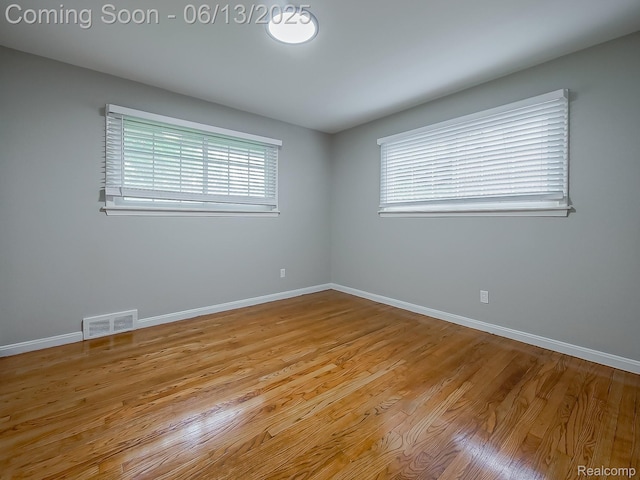 22854 Lingemann St, Saint Clair Shores, MI 48080 - spare room featuring baseboards and wood finished floors