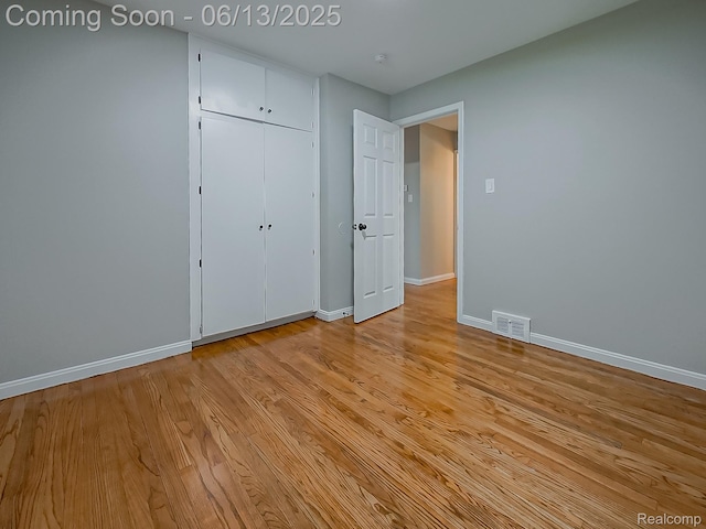 22854 Lingemann St, Saint Clair Shores, MI 48080 - unfurnished bedroom with light wood finished floors and a closet