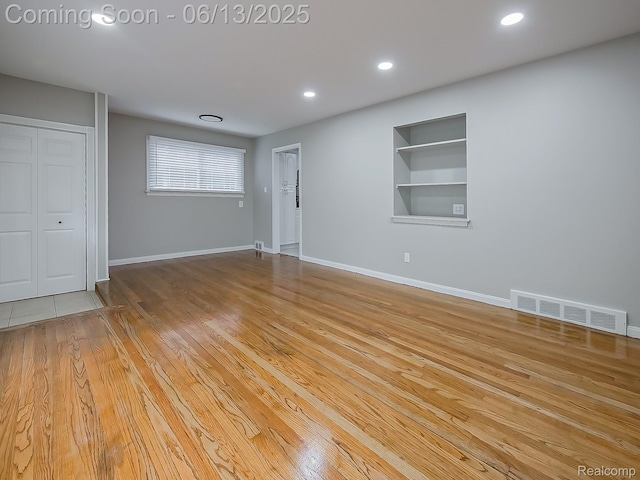 22854 Lingemann St, Saint Clair Shores, MI 48080 - unfurnished living room featuring built in features, wood finished floors, and recessed lighting