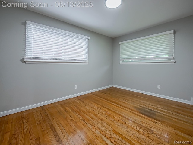 22854 Lingemann St, Saint Clair Shores, MI 48080 - spare room with baseboards and wood finished floors