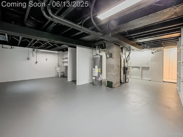 22854 Lingemann St, Saint Clair Shores, MI 48080 - basement featuring water heater and a sink