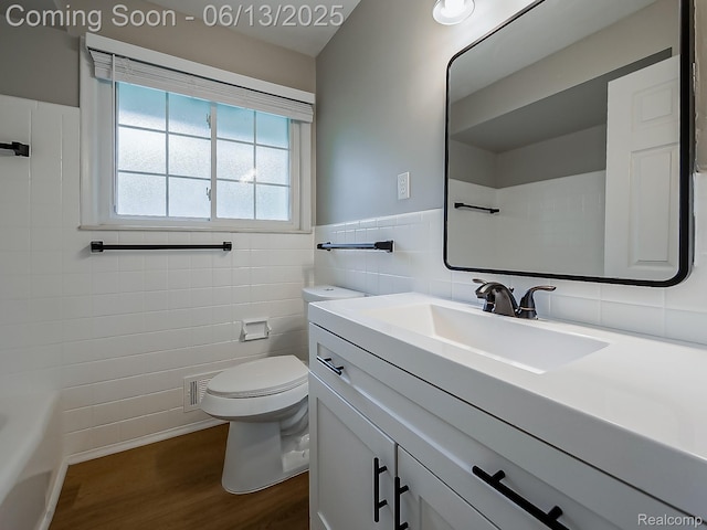 22854 Lingemann St, Saint Clair Shores, MI 48080 - full bathroom featuring tile walls, wood finished floors, vanity, and wainscoting