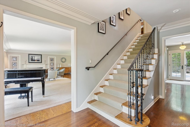 1831 Hampden Rd, Flint, MI 48503 - staircase featuring wood finished floors, ornamental molding, and a fireplace