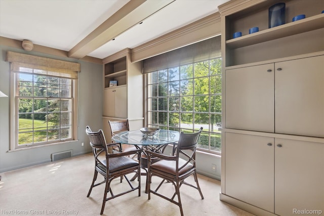 1831 Hampden Rd, Flint, MI 48503 - dining space with plenty of natural light, beamed ceiling, and light carpet