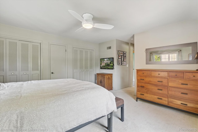 1831 Hampden Rd, Flint, MI 48503 - bedroom with multiple closets, light carpet, and ceiling fan