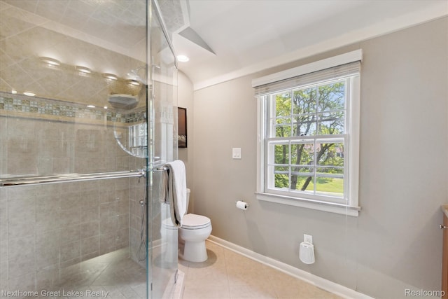 1831 Hampden Rd, Flint, MI 48503 - bathroom featuring a shower stall, healthy amount of natural light, lofted ceiling, tile patterned flooring, and vanity