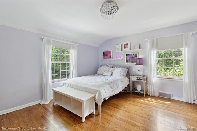 1831 Hampden Rd, Flint, MI 48503 - bedroom featuring vaulted ceiling and light wood-type flooring