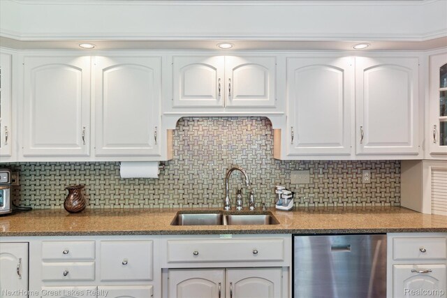 1831 Hampden Rd, Flint, MI 48503 - kitchen with dishwasher, white cabinets, and tasteful backsplash
