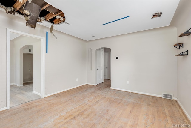852 Cambridge Rd, Berkley, MI 48072 - unfurnished room with arched walkways and wood finished floors