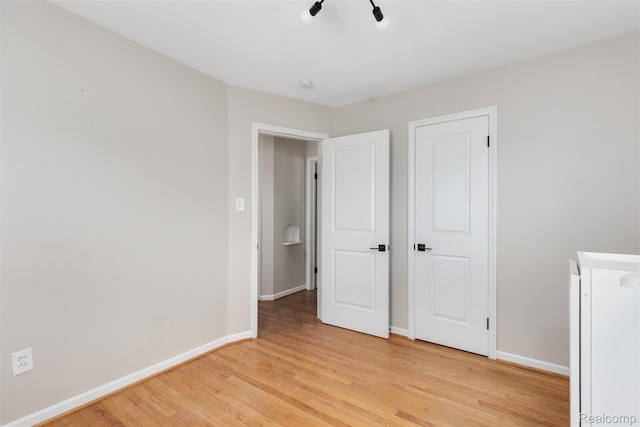 852 Cambridge Rd, Berkley, MI 48072 - unfurnished bedroom with light wood-type flooring and baseboards