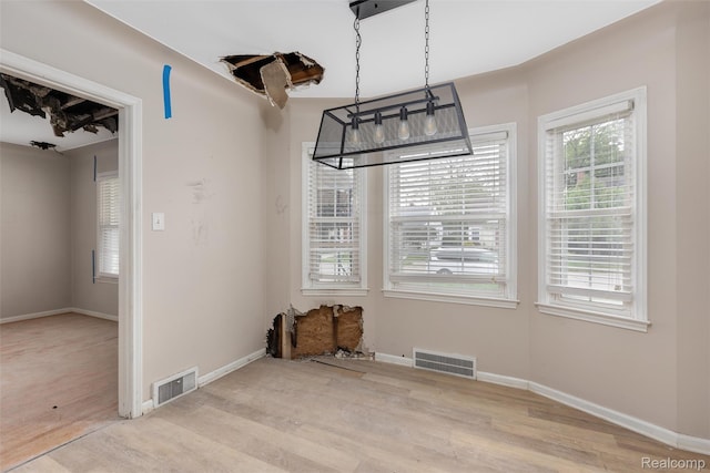 852 Cambridge Rd, Berkley, MI 48072 - unfurnished dining area featuring wood finished floors and baseboards