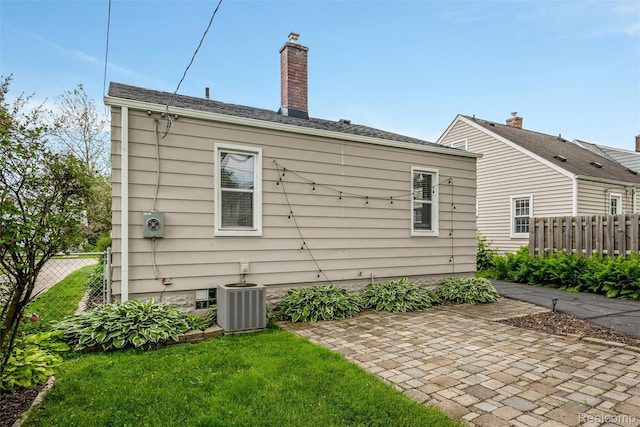 852 Cambridge Rd, Berkley, MI 48072 - rear view of property featuring a patio area and a chimney