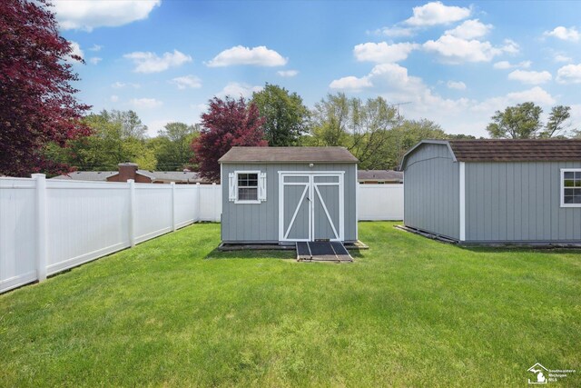1115 Birchwood Dr, Temperance, MI 48182 - view of shed with a fenced backyard