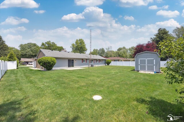 1115 Birchwood Dr, Temperance, MI 48182 - fenced backyard featuring a shed