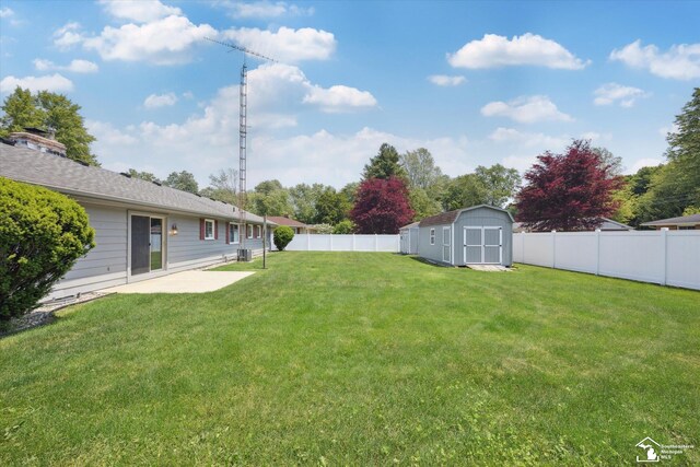 1115 Birchwood Dr, Temperance, MI 48182 - fenced backyard with a storage shed and a patio