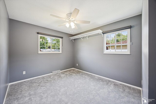 1115 Birchwood Dr, Temperance, MI 48182 - carpeted empty room featuring a ceiling fan and baseboards