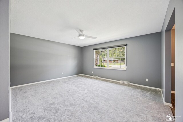 1115 Birchwood Dr, Temperance, MI 48182 - carpeted empty room featuring a ceiling fan and baseboards