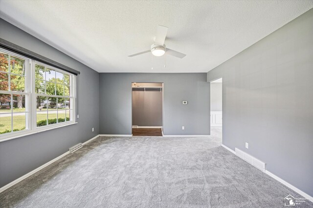 1115 Birchwood Dr, Temperance, MI 48182 - carpeted empty room with ceiling fan and a textured ceiling