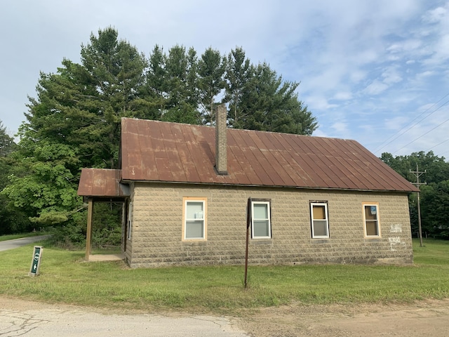 7193 E E 72nd St, Newaygo, MI 49337 - view of property exterior with a chimney and a lawn