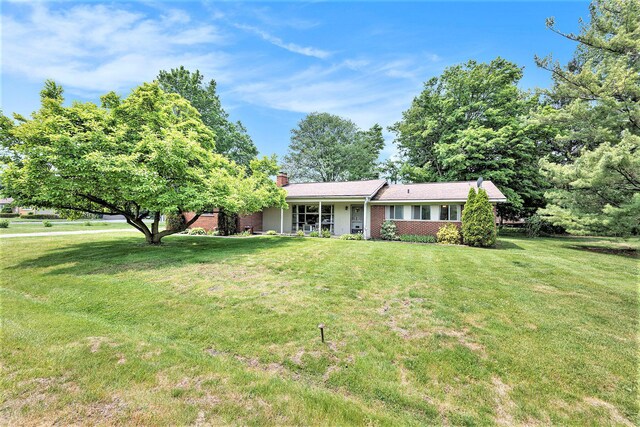 30151 Westfield St, Farmington Hills, MI 48334 - single story home with a front lawn, a chimney, and brick siding