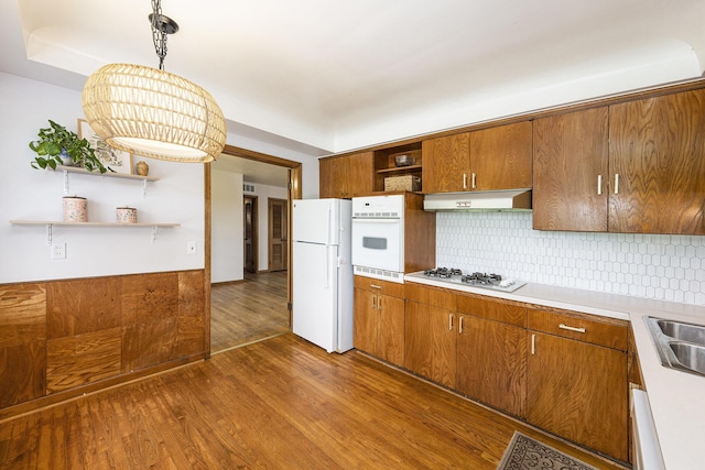 30151 Westfield St, Farmington Hills, MI 48334 - kitchen with open shelves, white appliances, range hood, dark wood-style floors, and brown cabinets
