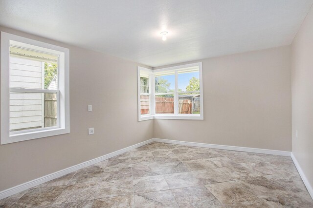 716 Langrick St, Sturgis, MI 49091 - spare room with baseboards and stone finish flooring