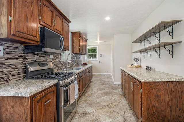 716 Langrick St, Sturgis, MI 49091 - kitchen with gas range, decorative backsplash, open shelves, light countertops, and recessed lighting