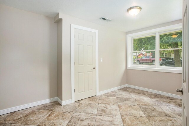 716 Langrick St, Sturgis, MI 49091 - spare room featuring baseboards and stone finish flooring