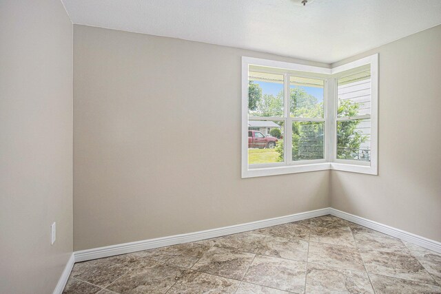 716 Langrick St, Sturgis, MI 49091 - spare room with baseboards