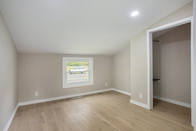 716 Langrick St, Sturgis, MI 49091 - unfurnished bedroom with light wood-style floors, lofted ceiling, and recessed lighting