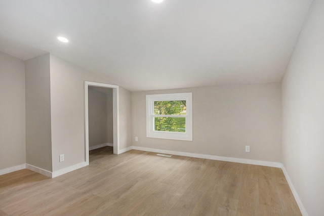 716 Langrick St, Sturgis, MI 49091 - spare room featuring vaulted ceiling, light wood finished floors, and recessed lighting