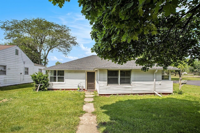 716 Langrick St, Sturgis, MI 49091 - view of front of house featuring a front lawn and a shingled roof