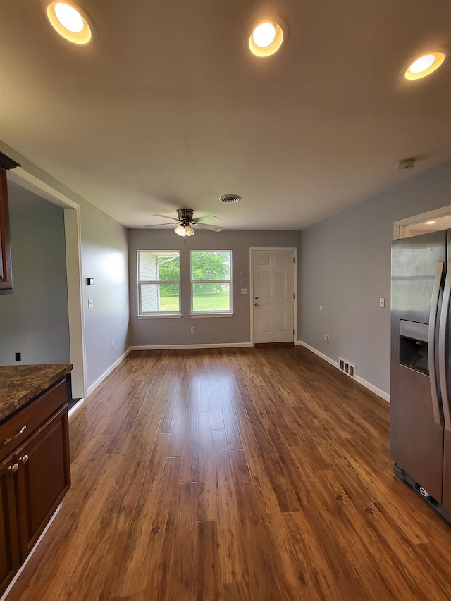3456 N Irish Rd, Davison, MI 48423 - unfurnished living room featuring ceiling fan and dark wood-type flooring