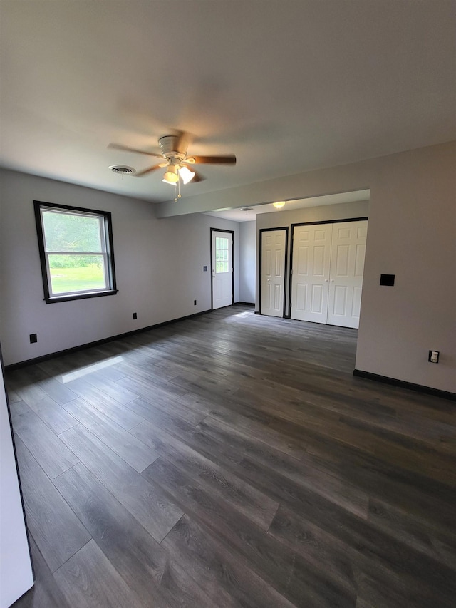 3456 N Irish Rd, Davison, MI 48423 - empty room with plenty of natural light, ceiling fan, and dark wood-type flooring