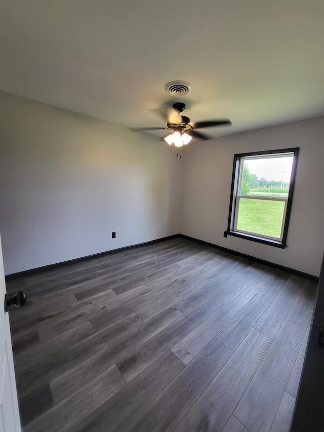 3456 N Irish Rd, Davison, MI 48423 - unfurnished room featuring ceiling fan and dark wood-type flooring