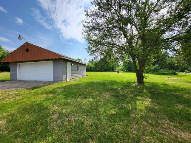 3456 N Irish Rd, Davison, MI 48423 - view of green lawn with a garage and an outbuilding