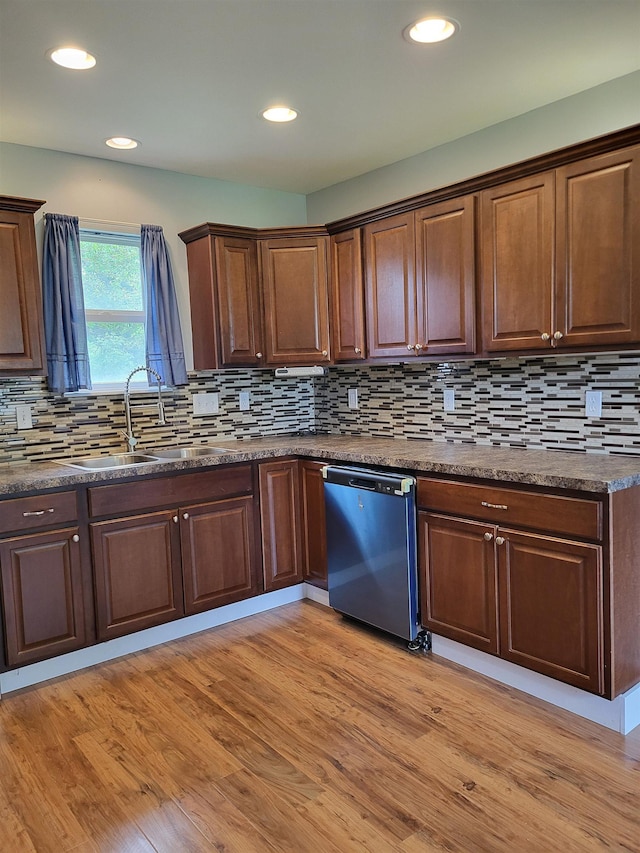 3456 N Irish Rd, Davison, MI 48423 - kitchen featuring dishwasher, dark countertops, light wood-style floors, recessed lighting, and tasteful backsplash