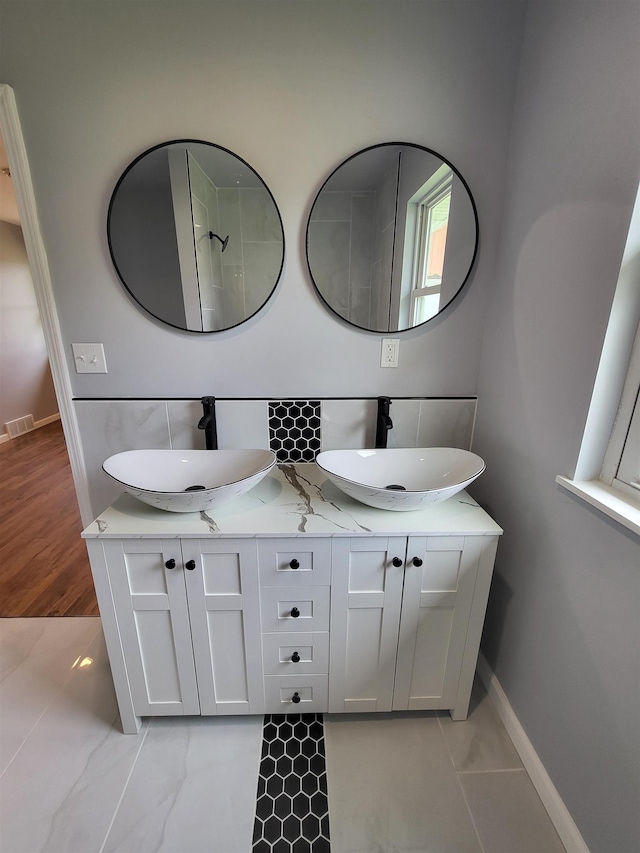 3456 N Irish Rd, Davison, MI 48423 - full bath featuring double vanity and backsplash