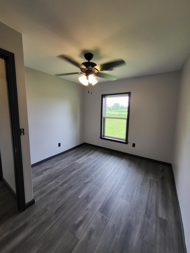 3456 N Irish Rd, Davison, MI 48423 - empty room featuring dark wood-style floors and a ceiling fan