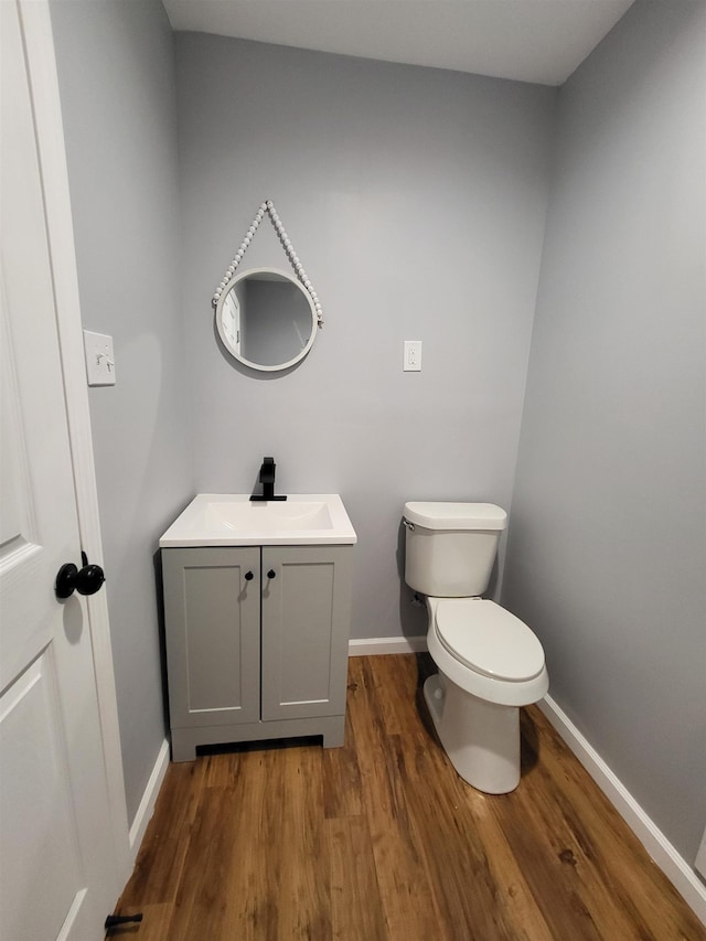 3456 N Irish Rd, Davison, MI 48423 - bathroom featuring vanity and wood finished floors
