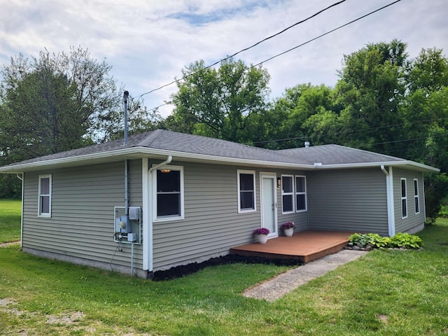 3456 N Irish Rd, Davison, MI 48423 - rear view of property featuring a lawn and a wooden deck