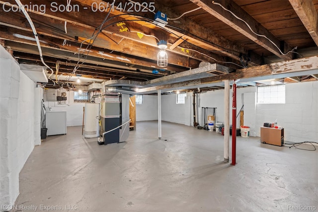 246 E Chesterfield St, Ferndale, MI 48220 - basement featuring gas water heater, heating unit, concrete block wall, and independent washer and dryer