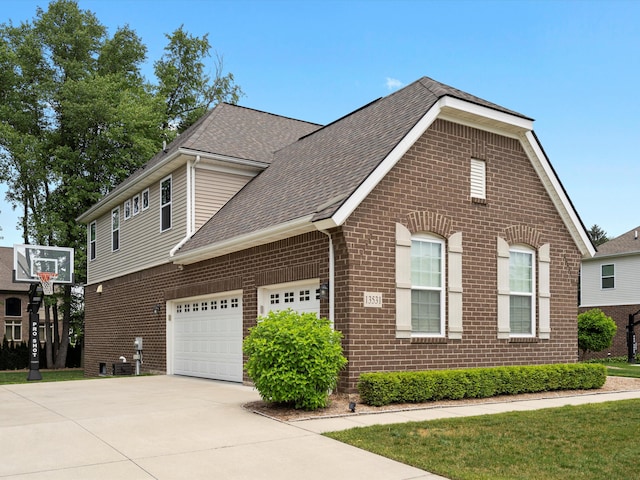 13531 Brampton Ct, Utica, MI 48315 - view of front facade featuring brick siding, concrete driveway, roof with shingles, and an attached garage